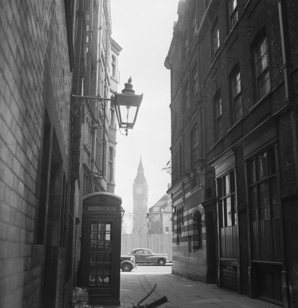 View of alleyway with houses of Parliament: 20th century