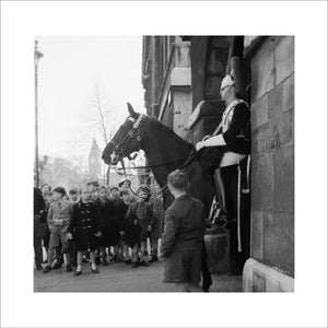 Children watch the horse guards: 1960