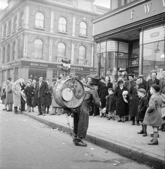 A one-man band in Camden High Street: 1952