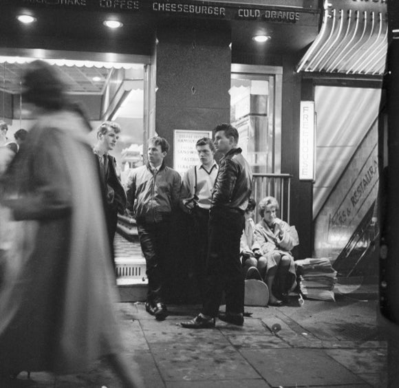 A group of 'teddy boys' outside a burger bar: 1962