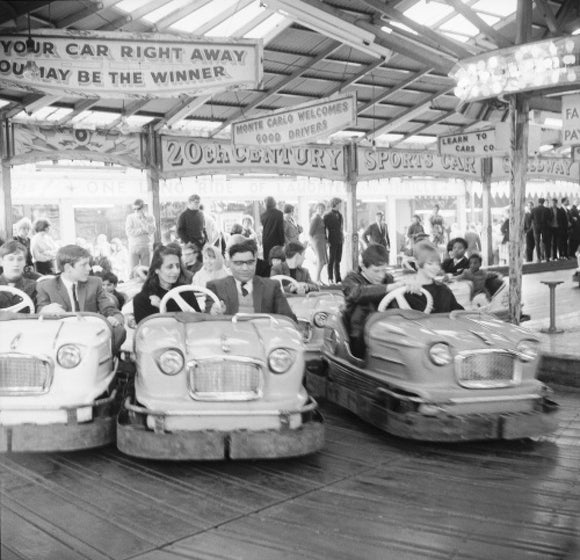 Couples on the dodgems ride, Battersea Park fun fair: 1966