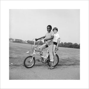 Two boys riding a bicycle: 1973