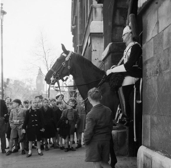 Children watch the horse guards: 1960