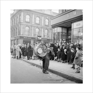 A one-man band in Camden High Street: 1952