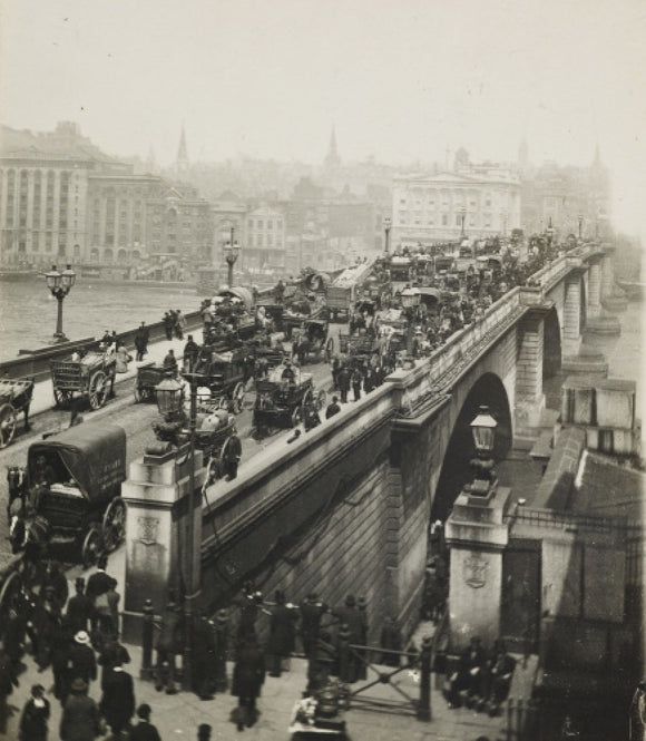 People crossing London Bridge; c1900