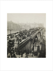People crossing London Bridge; c1900