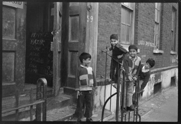 Children at the door of the Brick Lane Jamme Masjid Mosque: 1976