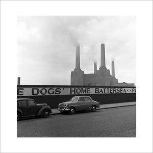 Two parked cars with Battersea Power Station in the background. c.1955